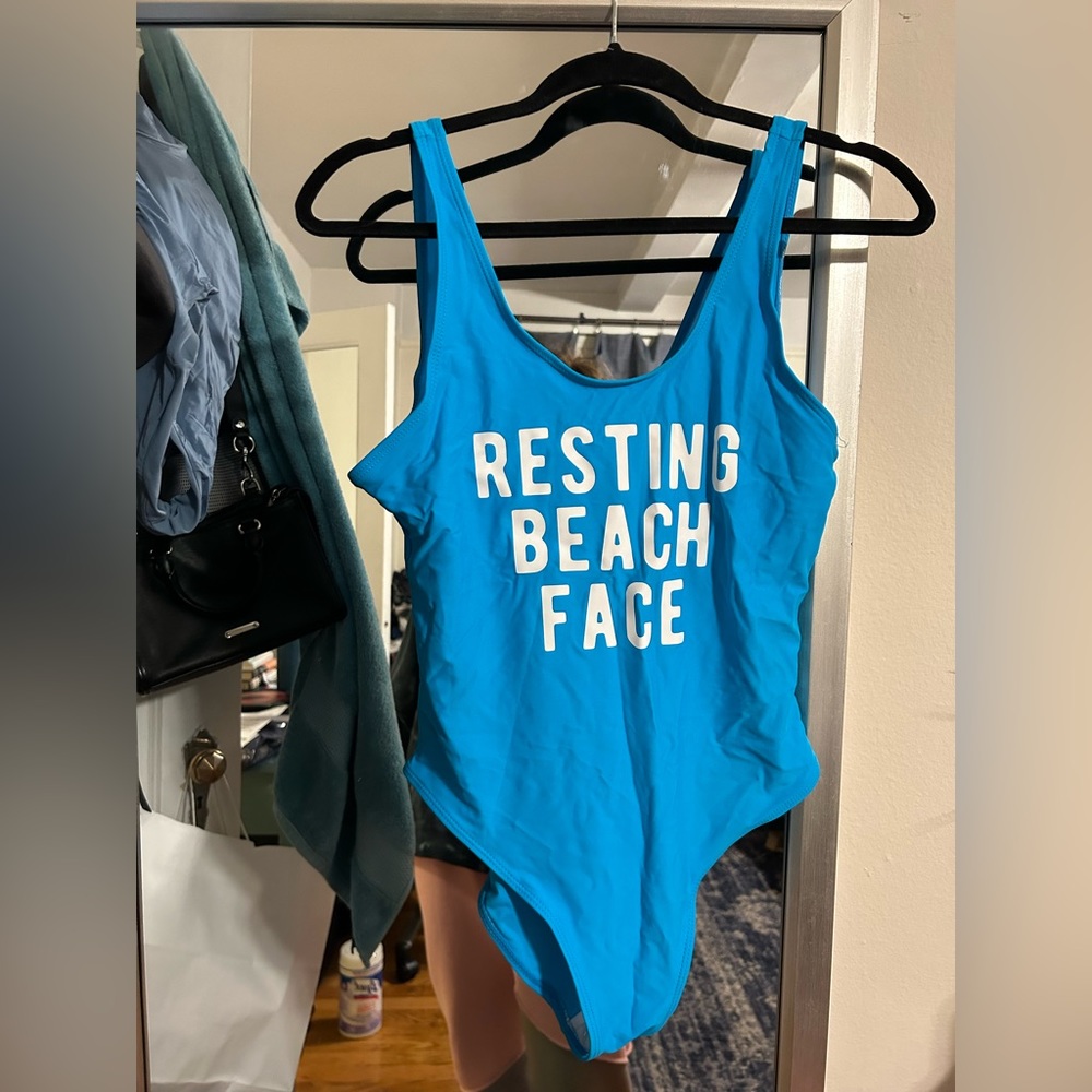 Blue “resting beach face” customized one piece bathing suit